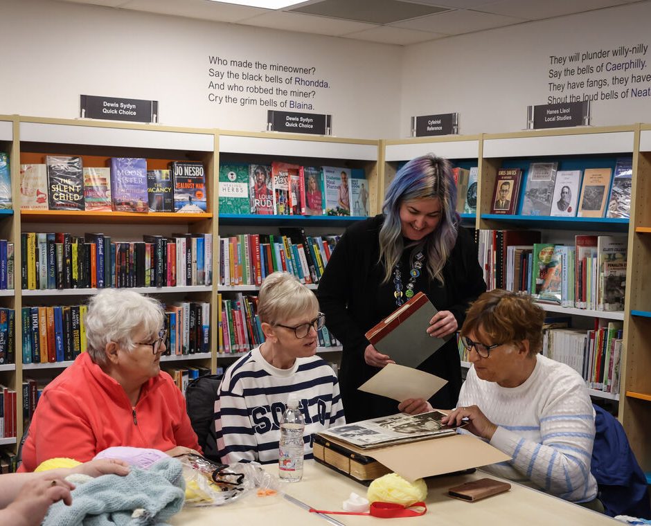 Looking at Photograph collection at Rhymney Library